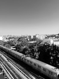 a black and white photo of a train on the tracks